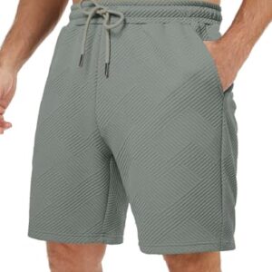 Hochwertige Herrenkurzehose in Grün mit Tasche für Outdoor-Aktivitäten wie Tennis, Jogging oder Fitnesstraining. Elastische Taille und praktische Paspel.