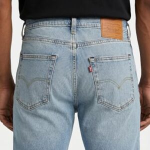 Levi's Herren 502 Taper Jeans in Call It Off, 36W/30L, dunkelblaue Jeans mit weißer Naht und orangem Etikett auf dem hinteren Taschenfach.