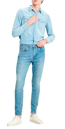 Levi's Herren Jeanshose 512 Low Rise, Tapered Fit, Blau (Pelikan-Rost), W33/L34 - Mann in blauen Jeans vor weißem Hintergrund